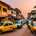 시에라리온 대중교통 수단 - A vibrant and bustling street scene in Freetown, Sierra Leone, at sunset. The narrow roads are fille...